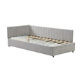 **Canapé-lit en velours gris avec finition capitonnée**